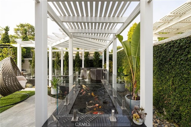 view of patio featuring a pergola and exterior kitchen