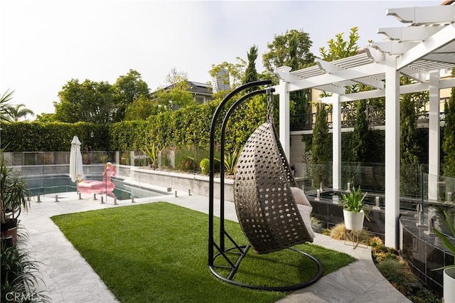 view of home's community featuring a lawn, a patio area, a pergola, and a swimming pool