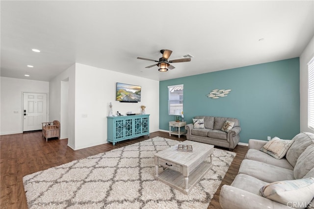 living room with ceiling fan, recessed lighting, visible vents, baseboards, and dark wood-style floors