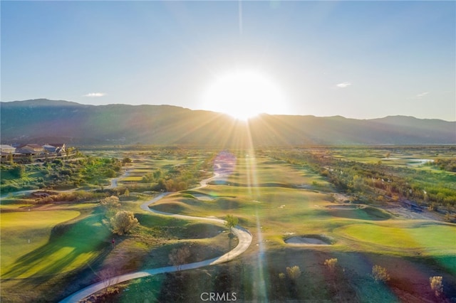 birds eye view of property with a mountain view and golf course view