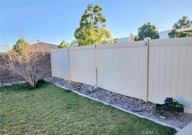 view of yard with a fenced backyard