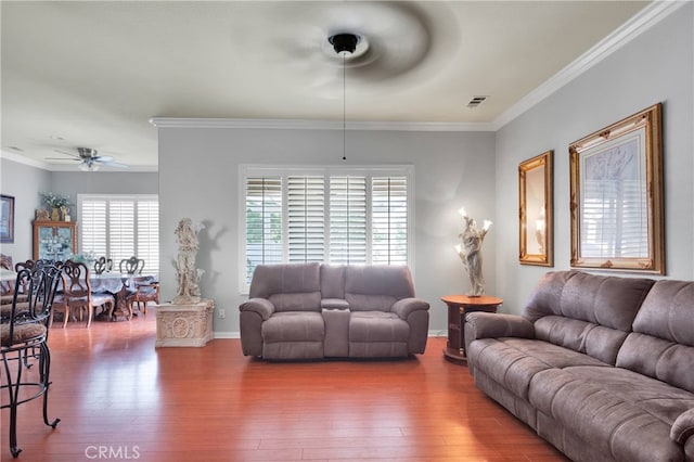 living room with crown molding, hardwood / wood-style floors, and ceiling fan