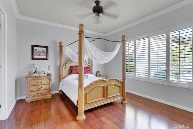 bedroom featuring ornamental molding, dark hardwood / wood-style flooring, and ceiling fan