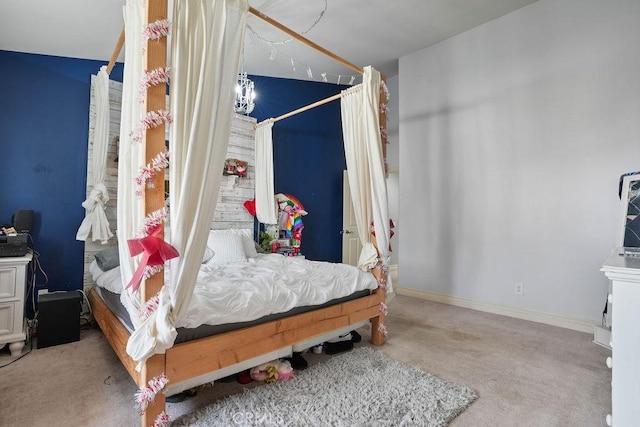 bedroom featuring light carpet