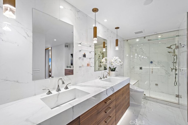 bathroom with a shower with shower door, toilet, and vanity