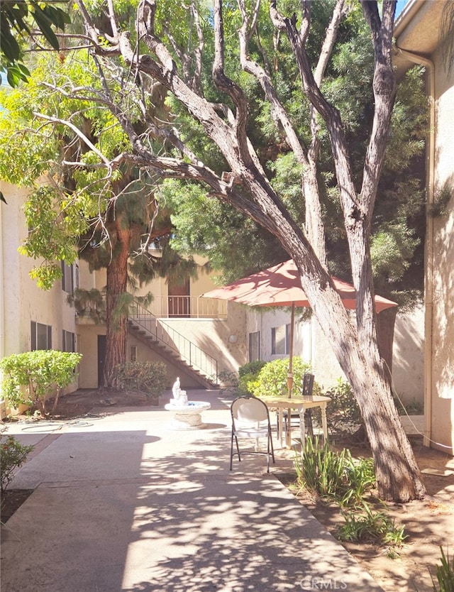 surrounding community with a patio area