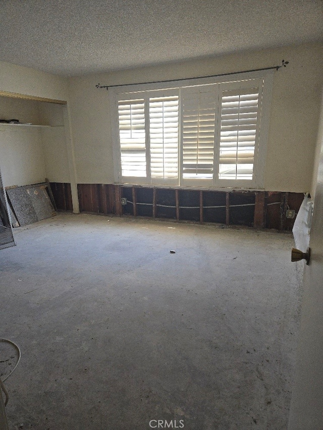 empty room with a textured ceiling