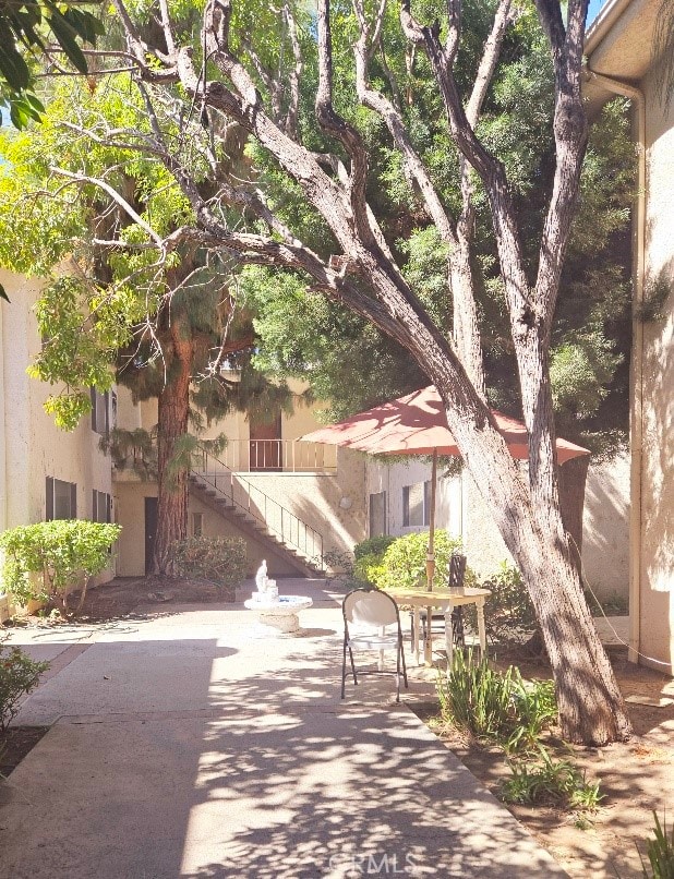 view of property's community featuring a patio area