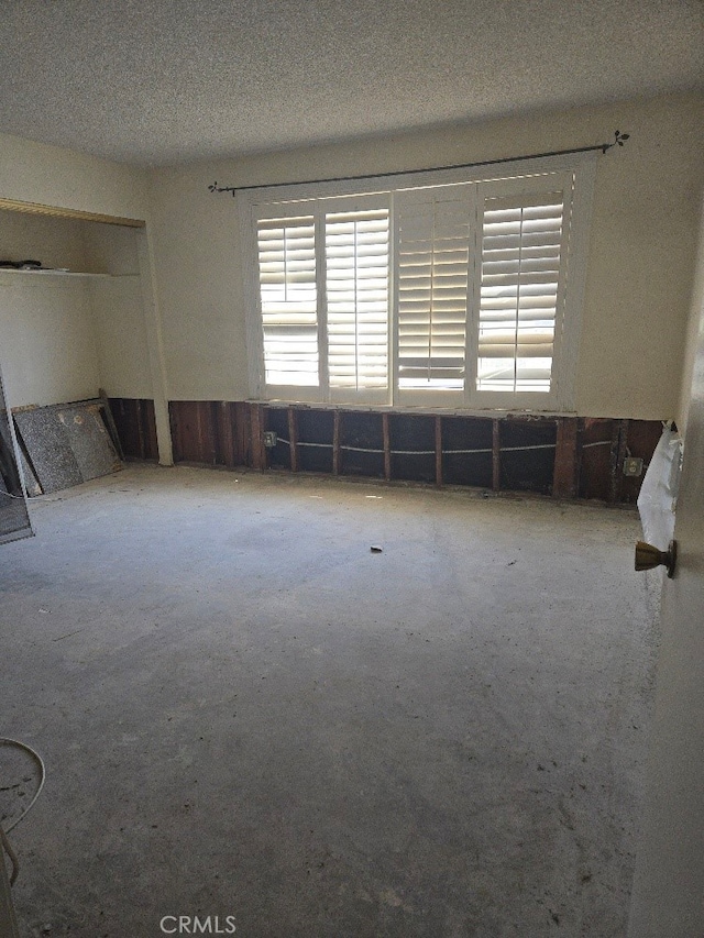 empty room with a textured ceiling