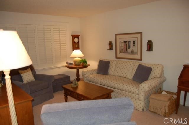 living room with light colored carpet