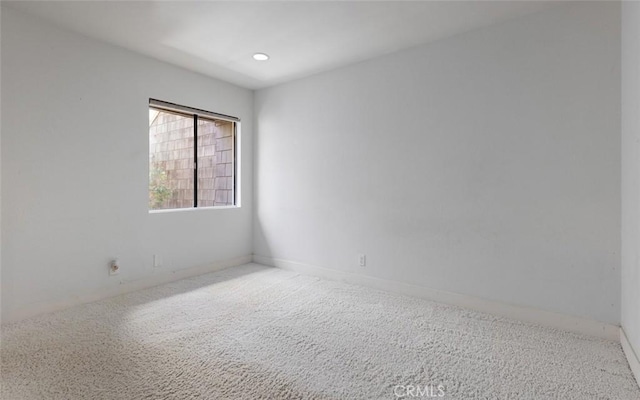 empty room featuring carpet flooring