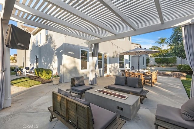 view of patio / terrace with an outdoor living space with a fire pit