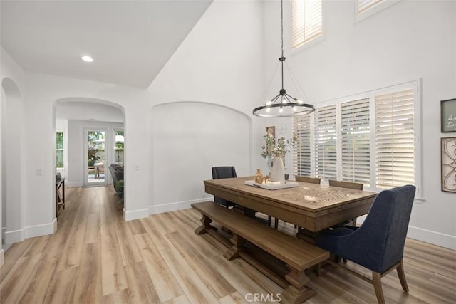 dining room with a notable chandelier and light hardwood / wood-style floors