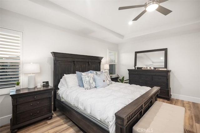 bedroom with ceiling fan and light hardwood / wood-style floors