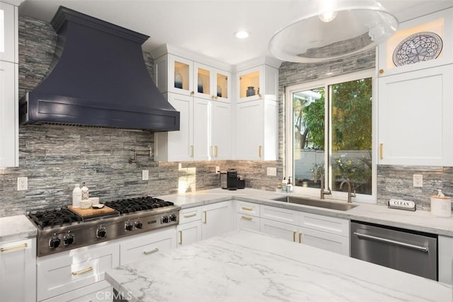 kitchen featuring premium range hood, stainless steel appliances, and white cabinets