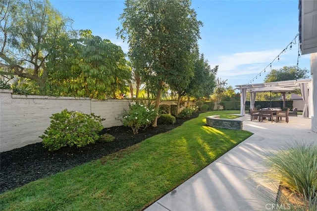 view of yard with a pergola and a patio