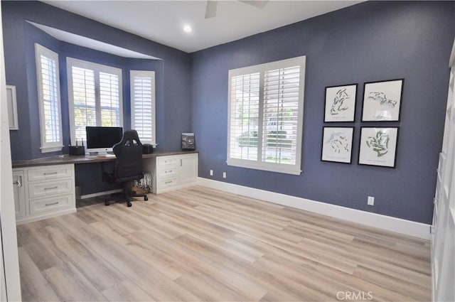 office featuring ceiling fan, a healthy amount of sunlight, and light wood-type flooring