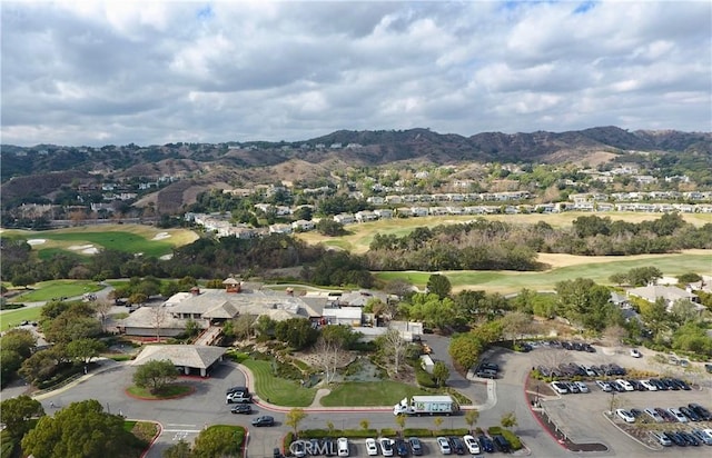 birds eye view of property with a mountain view