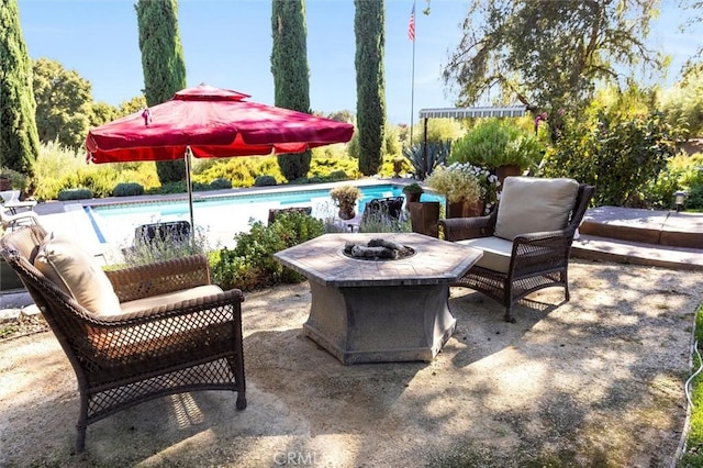 view of patio / terrace with a fire pit