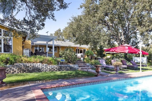 view of swimming pool with a patio area and a pergola