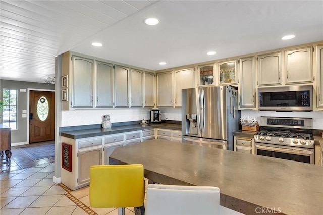 kitchen featuring light tile patterned floors and appliances with stainless steel finishes