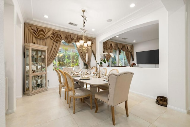 dining room featuring a chandelier, ornamental molding, and light tile patterned floors