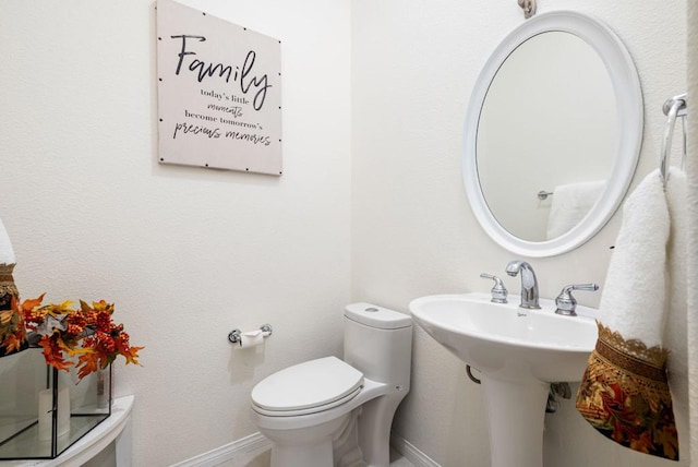 bathroom with sink and toilet