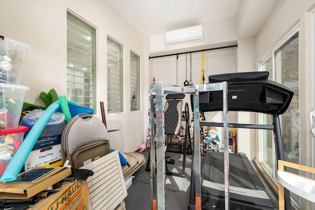 exercise room featuring an AC wall unit