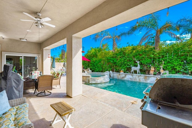 view of pool featuring an in ground hot tub, grilling area, ceiling fan, and a patio