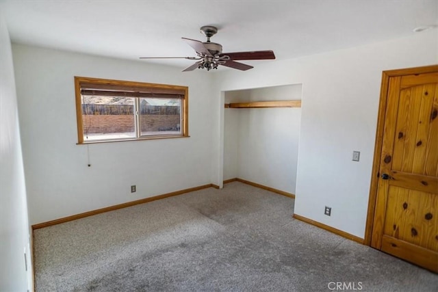 unfurnished bedroom featuring ceiling fan, a closet, and carpet floors