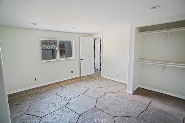 unfurnished bedroom featuring a closet