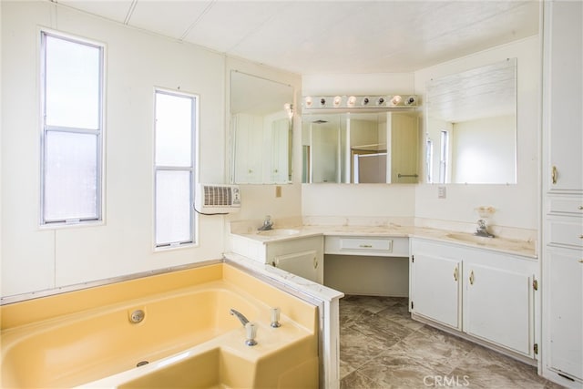 bathroom featuring a tub and vanity