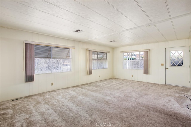 spare room featuring carpet floors