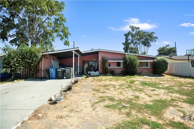 view of front of property featuring a carport