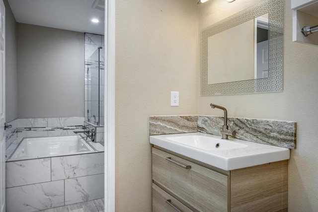 bathroom featuring vanity and a bathing tub