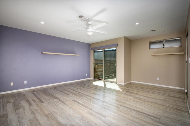 empty room with ceiling fan and light wood-type flooring