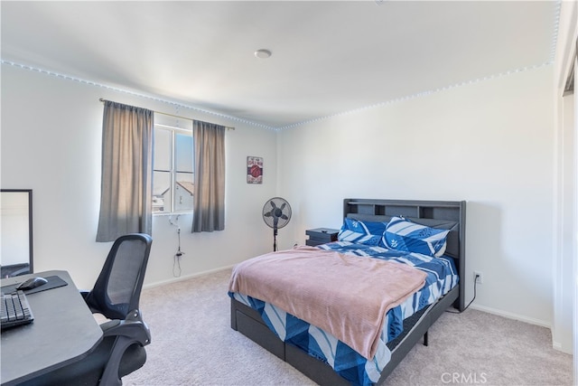 bedroom featuring light colored carpet