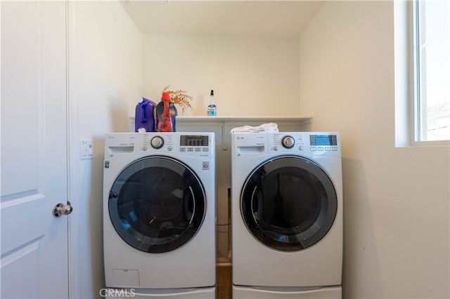 laundry room featuring washer and clothes dryer