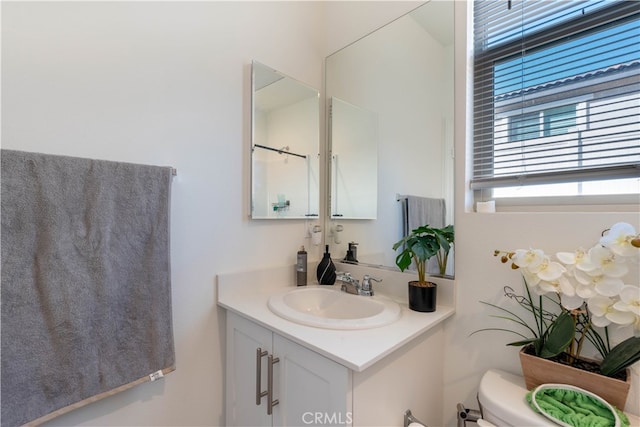 bathroom with vanity and toilet