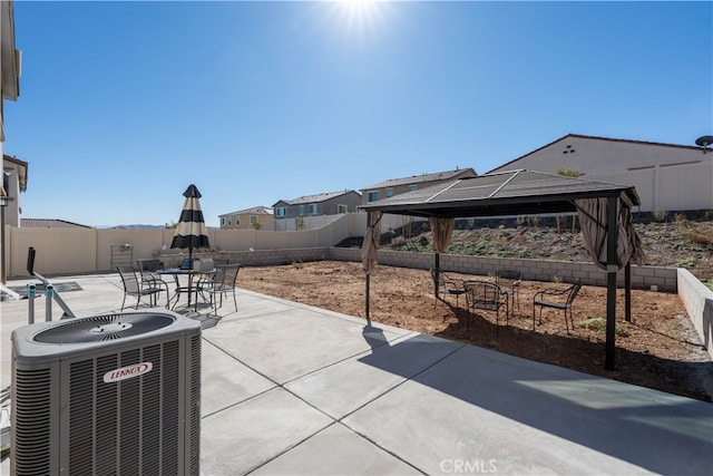 view of patio with a gazebo and central AC