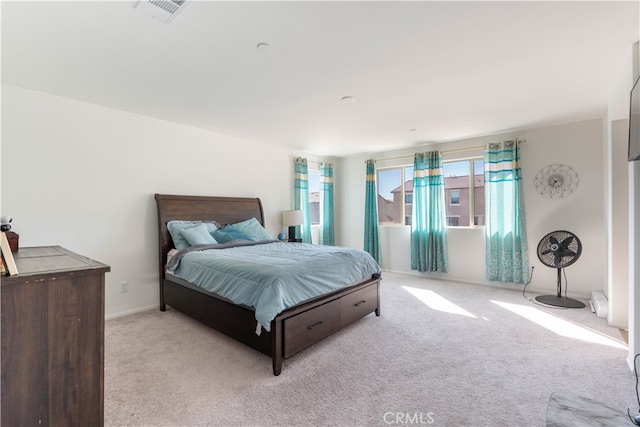 bedroom with light carpet