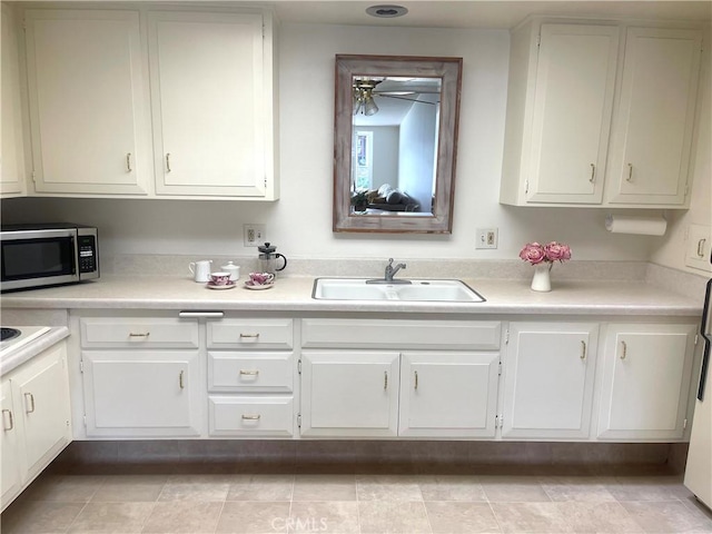 kitchen with sink and white cabinets