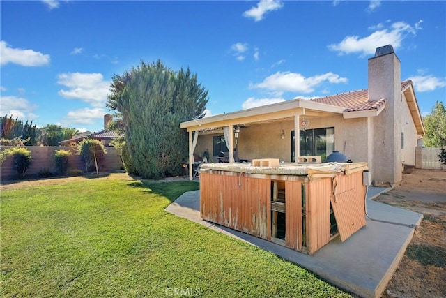 rear view of house with a yard