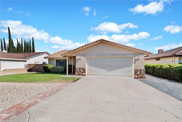 single story home featuring a garage and a front lawn