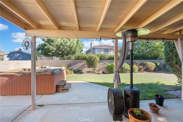 view of patio / terrace with a hot tub