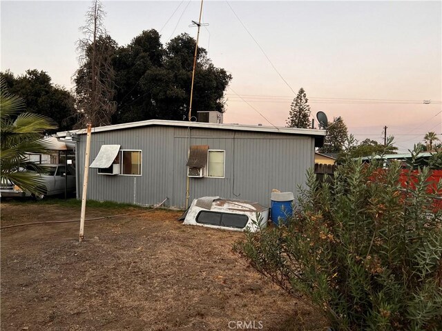 view of property exterior at dusk