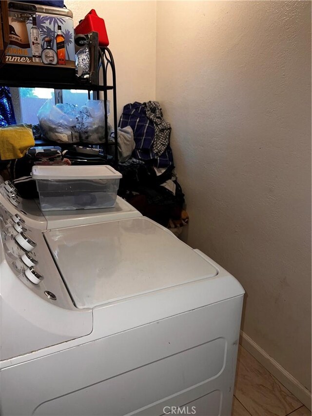 laundry area featuring tile patterned floors