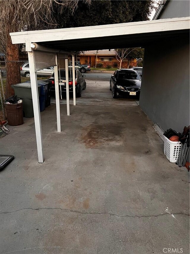 view of vehicle parking featuring a carport