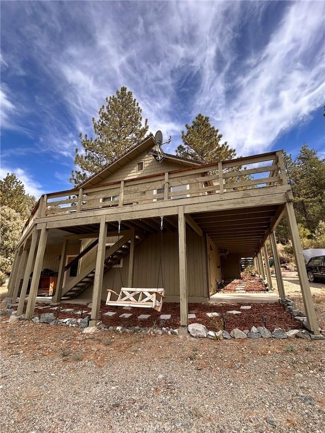 view of side of property with a deck