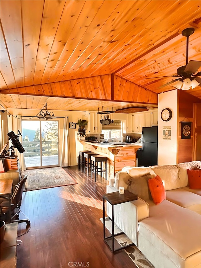 living room featuring dark hardwood / wood-style floors, wooden ceiling, and ceiling fan